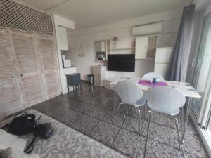a kitchen with a table and chairs in a room at La Siesta Apt in Salou