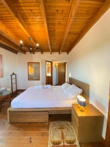 Uma cama ou camas num quarto em Casal Serrano Charme e Tranquilidade