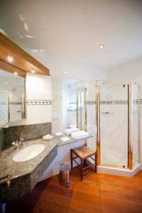 a bathroom with a sink and a shower at Chateau De Strainchamps in Fauvillers