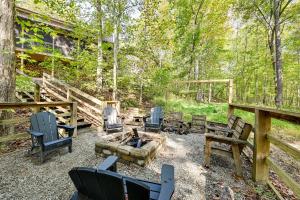 a group of chairs sitting around a fire pit at Nolin Lake Home with Hot Tub 15 Mi to Mammoth Cave! in Cub Run