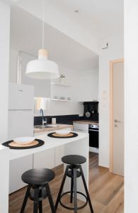 Kuchyňa alebo kuchynka v ubytovaní Alyvia Central Apartment 2 + 8 fotografií