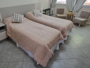 Una cama o camas en una habitación de Departamento Quinta Parque