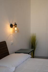 Postel nebo postele na pokoji v ubytování Murieri Rooms