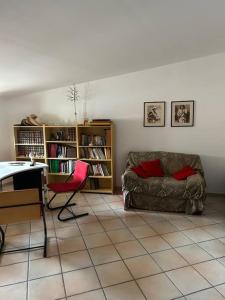 a living room with a couch and a chair at Casa Capoleto in Torre le Nocelle
