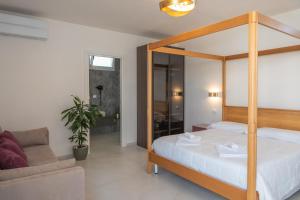 Postel nebo postele na pokoji v ubytování Murieri Rooms