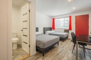 Postel nebo postele na pokoji v ubytování Motel Champlain