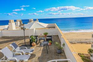 a balcony with a table and chairs and the beach at La Riviera Litoral - ONLY FAMILIES in Miami Platja