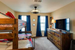 a bedroom with a bunk bed and a dresser at Lake Granbury Fishing Escape with Dock and Kayaks! in Granbury