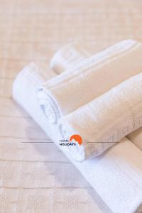 two rolls of toilet paper sitting on a table at #130 Praia Village by Home Holidays in Vilamoura