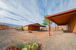 a group of huts in the middle of the desert at Marble Canyon Lodge in Marble Canyon