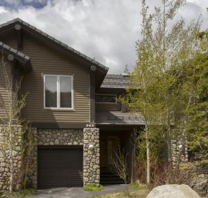 a house with a garage at Mammoth Golf Properties By 101 Great Escapes in Mammoth Lakes