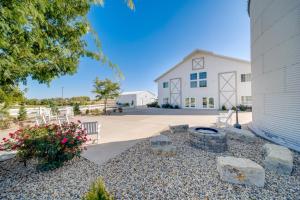 a large white building with a fire pit in front of it at Idyllic Biggsville Vacation Rental 10 Mi to River in Biggsville