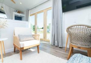 a living room with a chair and a window at Sun Outdoors Sugarloaf Key in Summerland Key