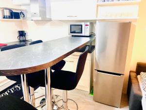 Kuchyň nebo kuchyňský kout v ubytování Practical Loft Comfort near Munich