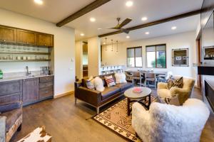a living room with couches and a kitchen at Sun Valley Condo with Furnished Patio Near Skiing! in Sun Valley