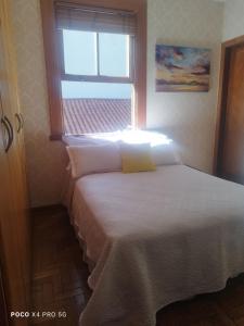 Кровать или кровати в номере Quarto Suite - SAVASSI BH