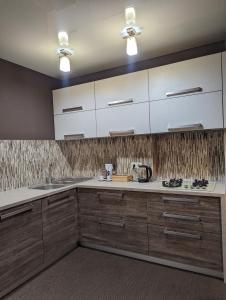 Kuchyň nebo kuchyňský kout v ubytování CosHOME - apartament