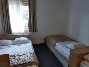 Ein Bett oder Betten in einem Zimmer der Unterkunft Apartman Masa Kopaonik