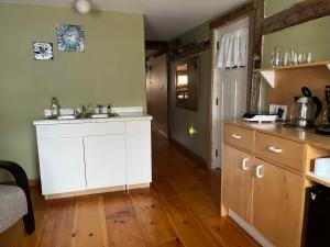 a kitchen with a sink and a counter top at Spellbound Farm in Union