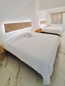 A bed or beds in a room at Casa Trébol: Tu Casa de Playa. Disfruta en familia