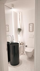 a bathroom with a tub and a toilet in it at Havuzlu , şömineli villa 