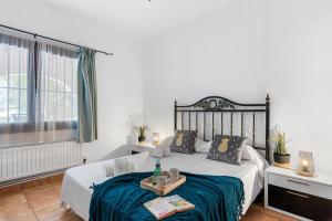 Łóżko lub łóżka w pokoju w obiekcie Villa Capricho - PlusHolidays