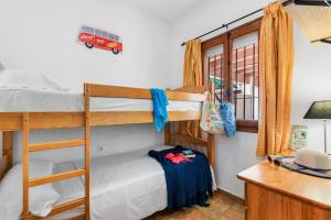 Łóżko lub łóżka w pokoju w obiekcie Villa Capricho - PlusHolidays