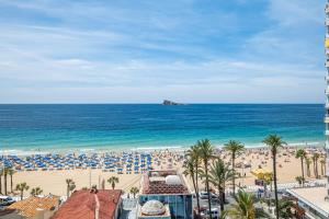 a view of the beach and the ocean at Acintur Apartment Levante Beach-Old Town in Benidorm
