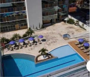O vedere a piscinei de la sau din apropiere de Flat em hotel Mercure