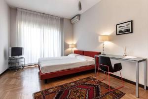 מיטה או מיטות בחדר ב-Silenzioso Appartamento Repubblica Home
