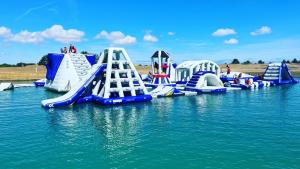 a row of inflatable slides in the water at Myrtles Barn Amazing Renovated 2 Bed No Guest Fee in Kent