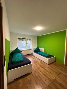 Postel nebo postele na pokoji v ubytování Pension „Haus 11“ Lauta