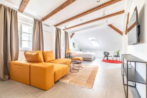Televízia a/alebo spoločenská miestnosť v ubytovaní Apartman Kaptol