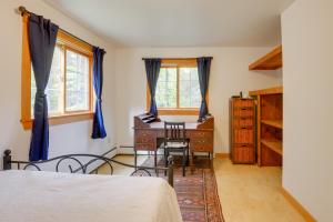 a bedroom with a desk and a table and chairs at Charming Putney Home Porch, Grill and Hiking Trails in Putney