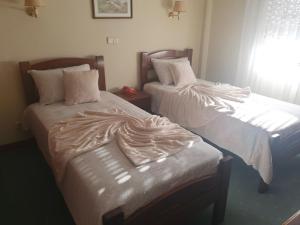 Postel nebo postele na pokoji v ubytování Hotel Peninsular