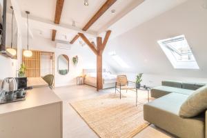 a living room with a couch and a table at Apartman Kaptol in Zagreb