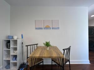 a dining room table with chairs and a shelf at 1BR Fully Handicap Accessible Near Downtown in Greenville