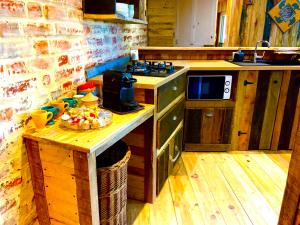 a kitchen with a counter with a bowl of fruit on it at Charmant logement en bord de rivière et proche de la gare du Mans in Le Mans