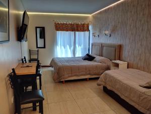 Ένα ή περισσότερα κρεβάτια σε δωμάτιο στο Microcentro y Obelisco +18 φωτογραφίες