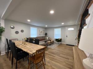 a living room with a table and a couch at 5BR 4B Huge Space with 2 Level Game Barn in Greenville