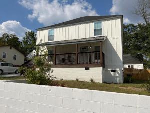 a house with a balcony on the side of it at 5BR 4B Huge Space with 2 Level Game Barn in Greenville