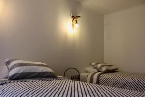 Cama o camas de una habitación en Hostal Alamo Patagonico