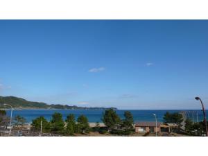 a view of the ocean from a building with a street light at Pulse Inn Katsuura - Vacation STAY 44386v in Temma +11 photos