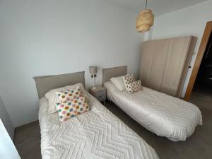 Postel nebo postele na pokoji v ubytování Casa Los Caños de Alhama