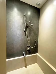 a shower in a bathroom with a wall at Un écrin à Cassis in Cassis +23 photos