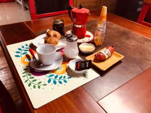 a table with a tea set on top of it at B&B Patagonia Dreams in Puerto Montt