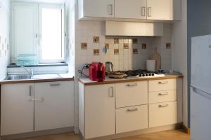 A kitchen or kitchenette at Casa Adalù