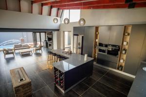 a kitchen and living room with a view of the ocean at Villa 698 tswinga in Thohoyandou