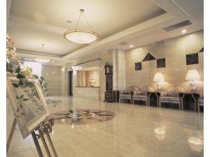 a lobby with couches and a glass table at Hotel Montagne Matsumoto - Vacation STAY 73668v in Matsumoto