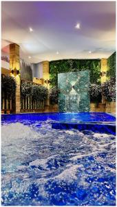 a room with a pool of water in a building at Villa Almedina Spa in Vlasic